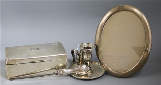 A George III silver chamberstick and snuffer and three other items,